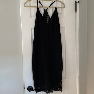 Lulus lace back and hem midi cocktail dress with adjustable spaghetti straps.